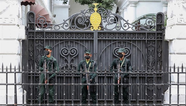 Army solders stand guard outside the President's palace in Colombo