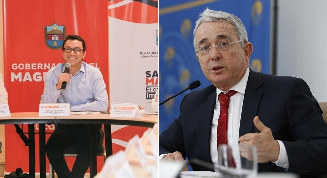 Carlos Caicedo, izq.- Álvaro Uribe, der.